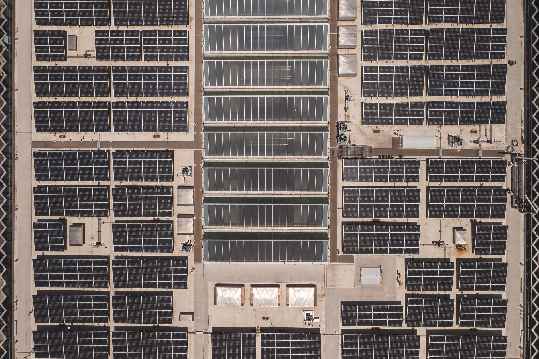 Solar panels on a large rooftop.