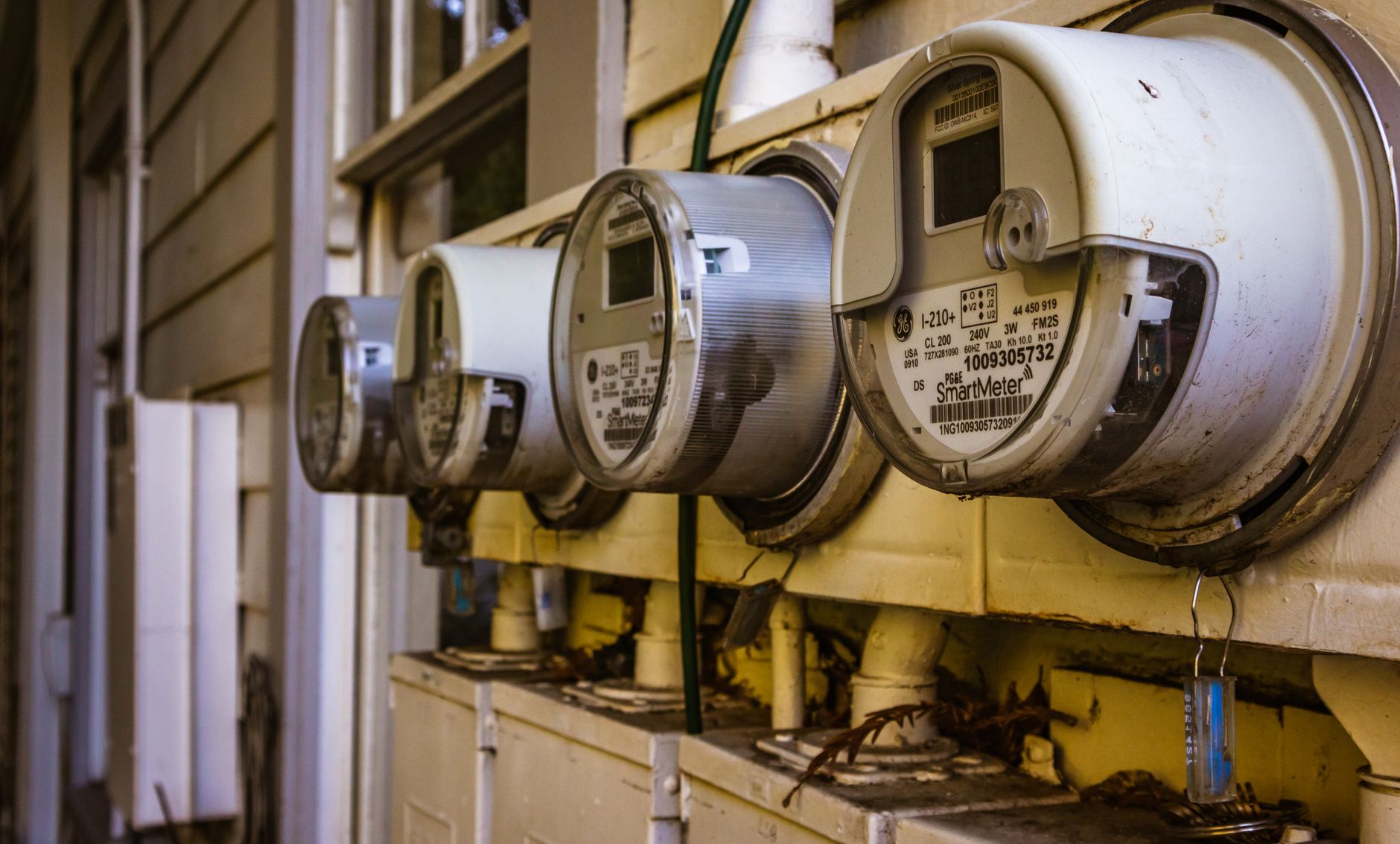 Smart electricity meters installed on an exterior wall.